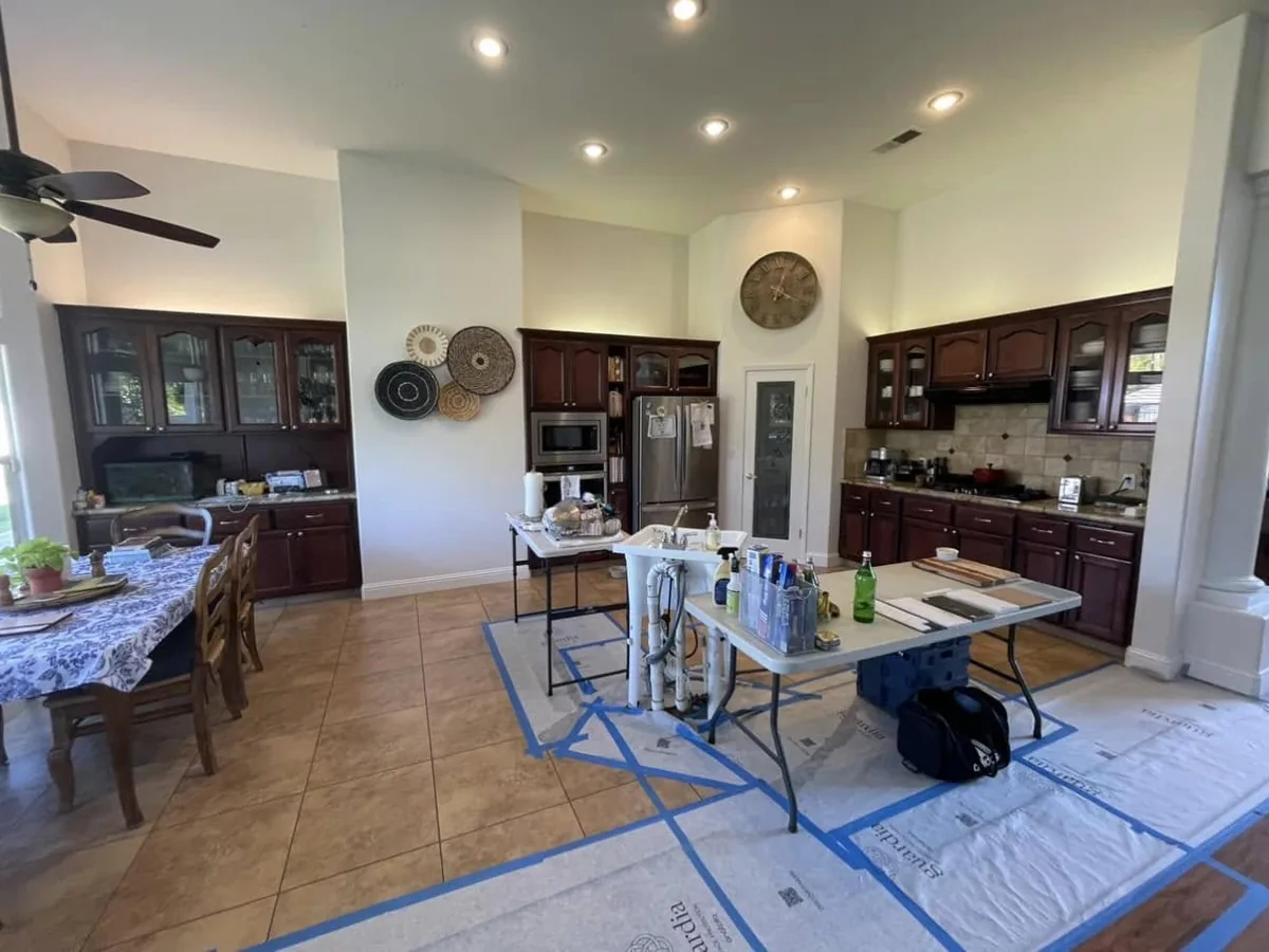 Before: kitchen with dark cherry cabinets during remodel